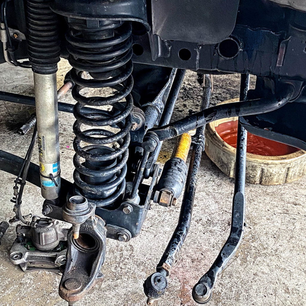 Tie rods and track bar on a Jeep that is in for repairs because of Death Wobble